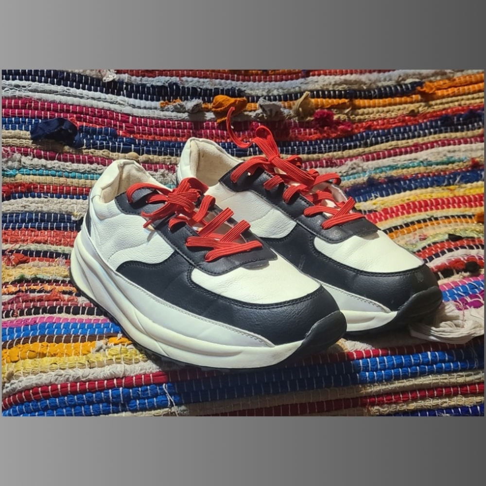 Stylish Black and White Sneakers with Red Laces